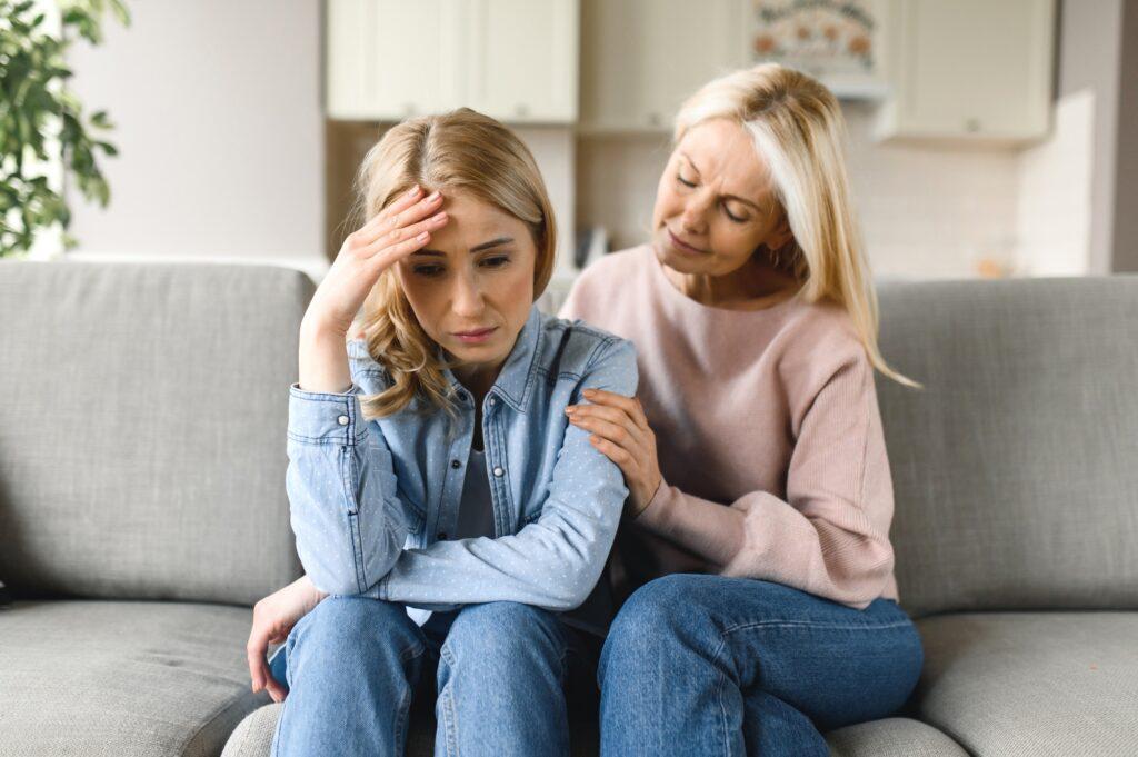 worried mature mother daughter problem support sad