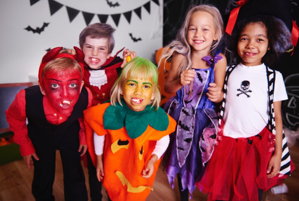 Kids posing in halloween costume